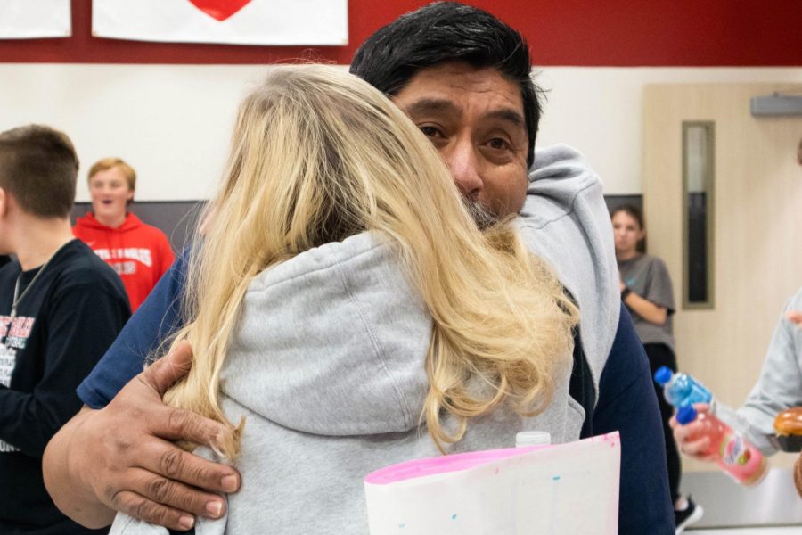 Longtime district employee Janitor Joe celebrates his last day with the district at Argyle High School in Argyle, Texas. Students and administration organized a surprise party that included a cake and various gifts. (Jaclyn Harris | The Talon News)  