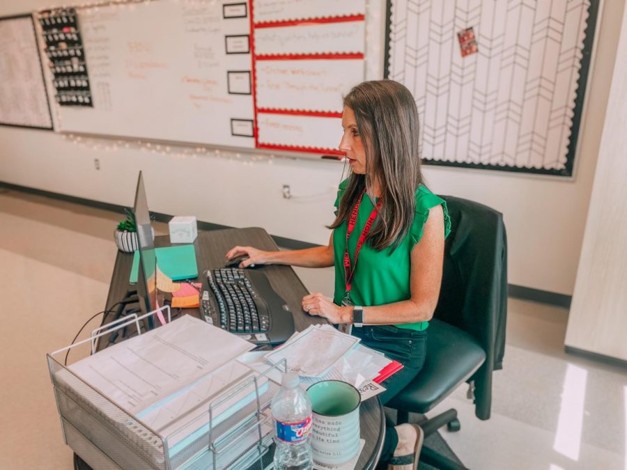 Freshman English teacher Melanie Henderson works at her desk.