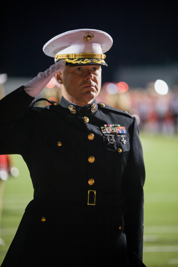 During the national anthem on Nov. 5, Timian Lewis salutes to the flag before the Eagles play in their senior night football game at the Argyle High School stadium. Lewis is the first in his family to serve in the U.S. Marine Corps. “Actually it was a legacy of the generations in my family,” Lewis said. “I chose the Marines because it was the toughest my dad told me.” 