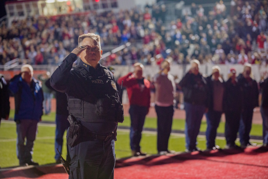 Before the Eagles play in their senior night football game, Chief Cairney leads the veterans in a salute to the flag on Nov. 5 at the Argyle High School stadium. Chief Cairney is the police officer at Argyle High School. “After my time at the Air Force Academy I served as a commissioned officer for 21 years and retired in 2013,” Cairney said. “I always knew the United States was and is a special place and one which we need to defend.” 