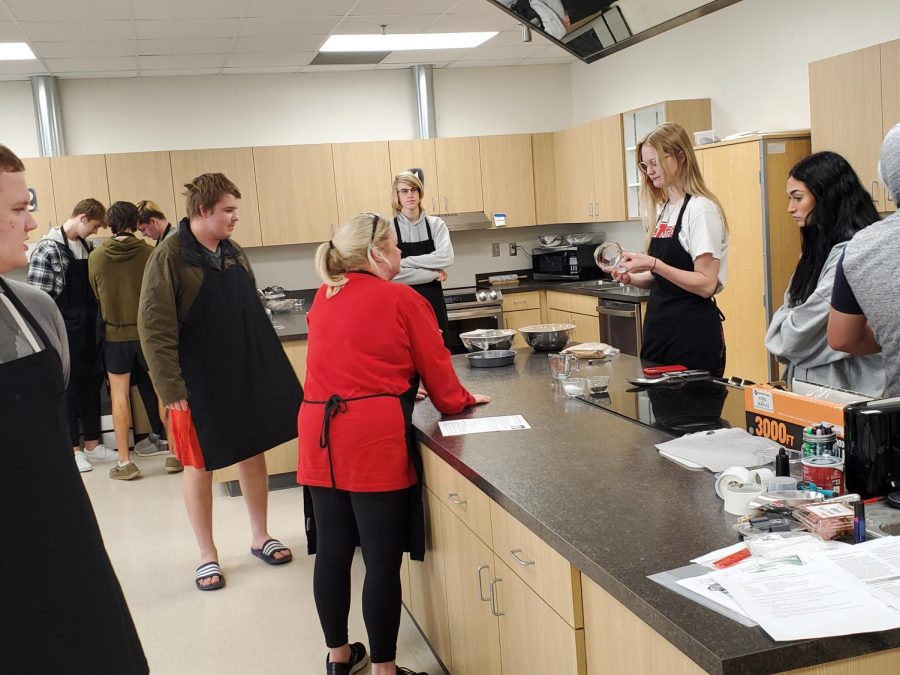 Students in Mrs. Greenwoods culinary class gather materials in order to prepare for their upcoming assignment.