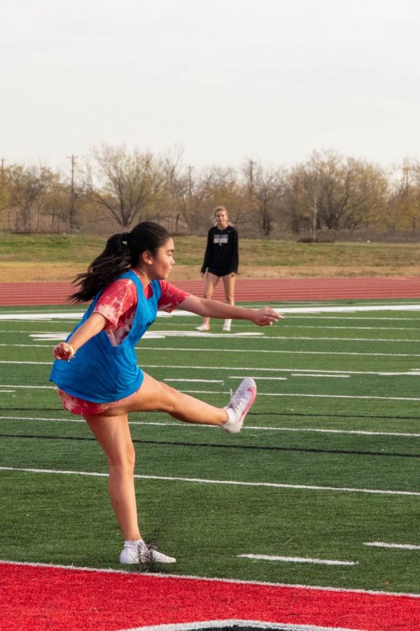 Freshman Hannah Solano crosses the ball from the side of the field into the middle. Solano prepares for the season by practicing her shots as she progresses this starting year. “Our bonding and chemistry this year will make us stronger than last year,” junior Kennedi Banar said.

