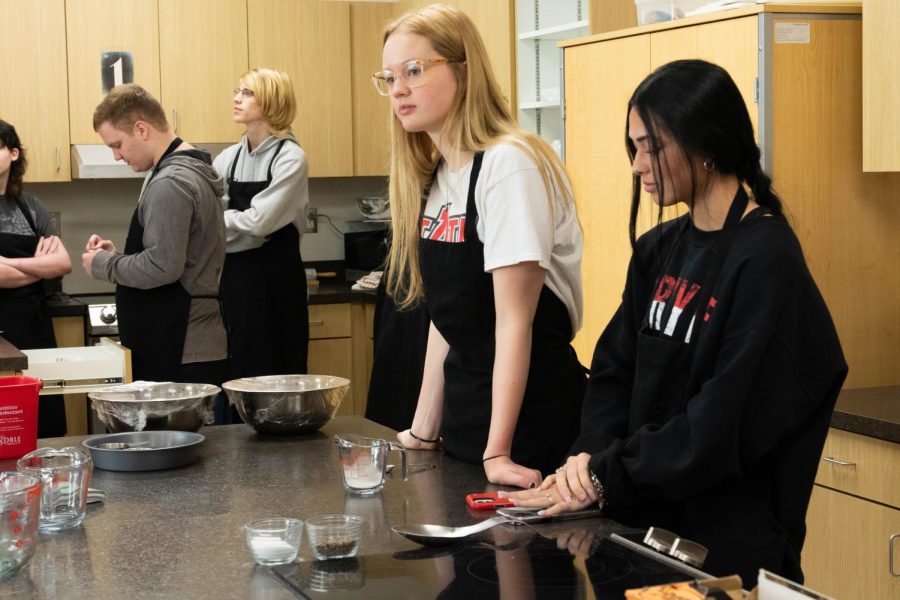 Students in culinary class learn how to measure ingredients properly.