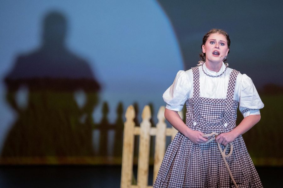 Senior Carlin Clark, sings her solo, Somewhere Over The Rainbow, as Dorthy Gale in The Wizard of Oz on January 20, 2022, in the new Argyle High School Auditorium. (©The Talon News | Cate Clark)