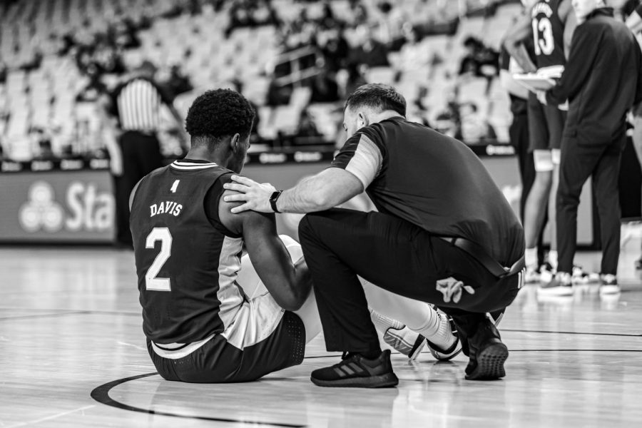 Mississippi State redshirt junior Javian Davis is helped out by the medical staff on the court during a basketball game against Colorado State on Dec. 11, 2021 at Dickies Arena in Dallas. 
