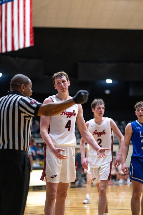 Senior Nate Atwood discusses a foul with the refs in Italy, Texas on Feb. 25, 2021.