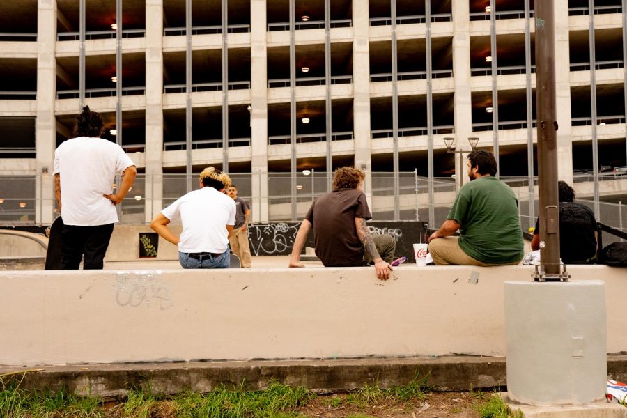 A group of friends hangs out on the manual pad at House Park, Austin, Texas, on Mar. 3, 2021.