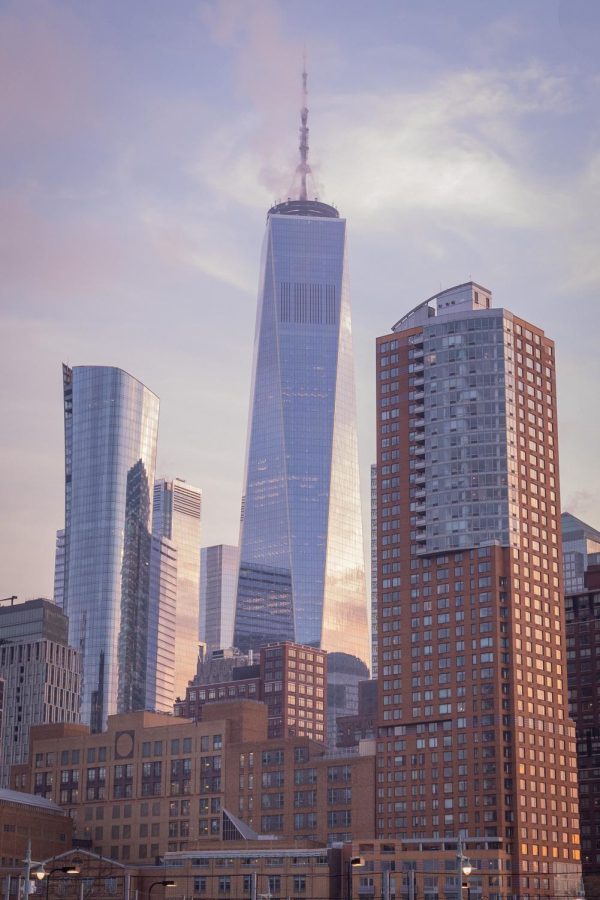 The World Trade Center stands out during the sunset on the East coast of Manhattan Island on Dec. 31, 2021.