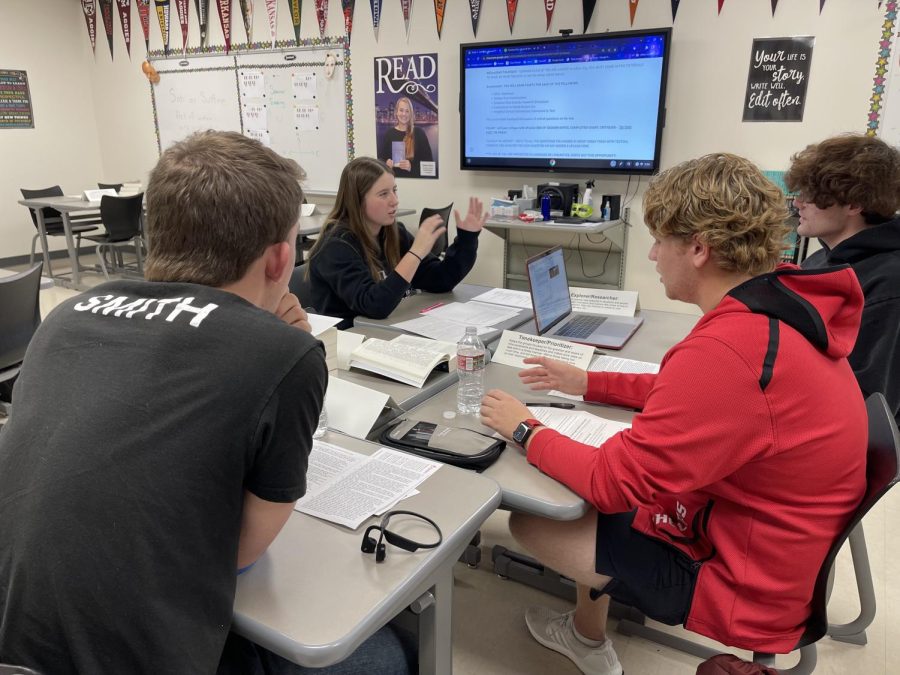 Seniors Connor Smith, Taylor Troseth, Sam Mykel and Kiyan Phelps complete a major test seminar assignment in Stacy Shorts English IV AP and dual credit course, Oct. 26, 2022.