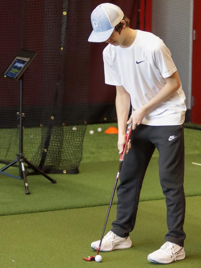 Jack Mara practices putting during the JV practice at the Argyle Middle School field house, March 2nd, 2022.