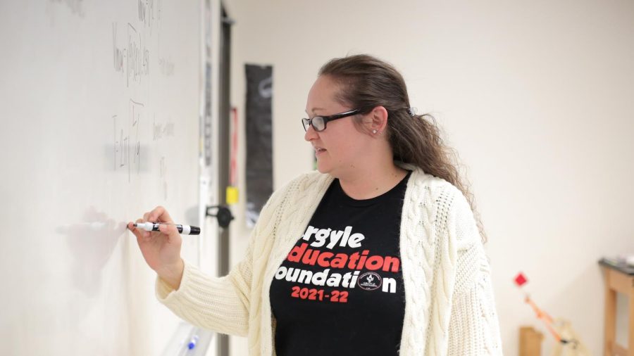 Ashley Allen works through circuit equations with her AP physics class at Argyle High School on March 3, 2022.