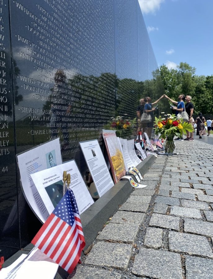 The Vietnam War Memorial has observes looking for the names of lost soldiers, as information and gifts litter the bottom of the memorial. Taken on May 30, 2023.