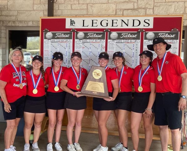 The AHS Girls Varsity show off their 4A state championship medals and trophy at the Legends Golf course.