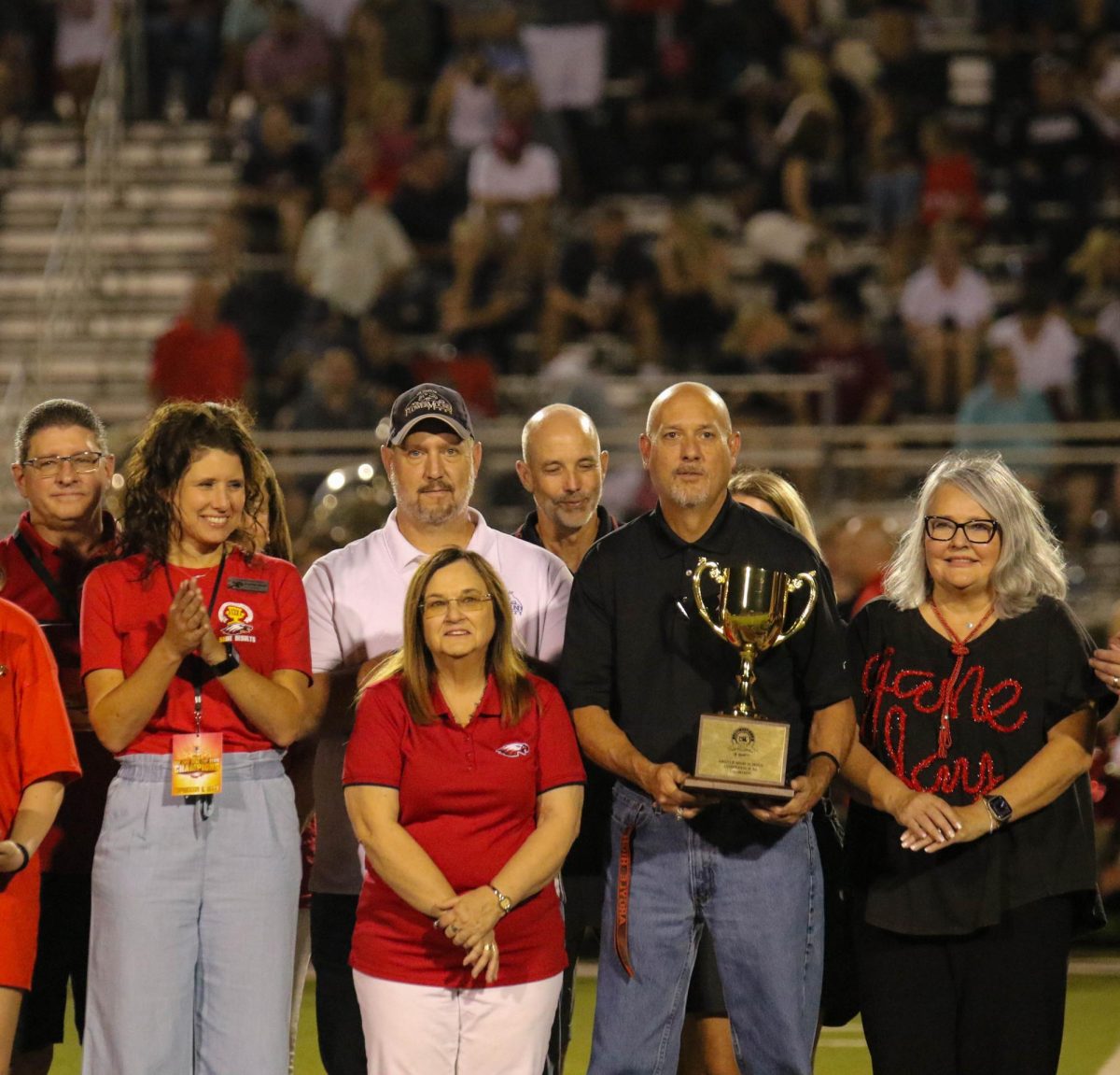 In order from left to right: Argyle Mayor Rick Bradford, Argyle ISD Superintendent Dr. Carpenter, former superintendent Dr. Wright, Board of Trustee Place 3 Sam Slaton, Board of Trustee Place 4 Ritchie Deffenbaugh, Argyle High School Principal John King, and Texas House Rep. Kronda Thimesch accept the UIL Lone Star Cup on Sep. 1, 2023 at Eagle Satdium.